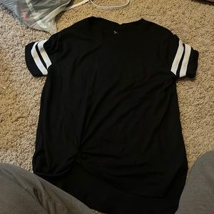 Black varsity tee shirt.